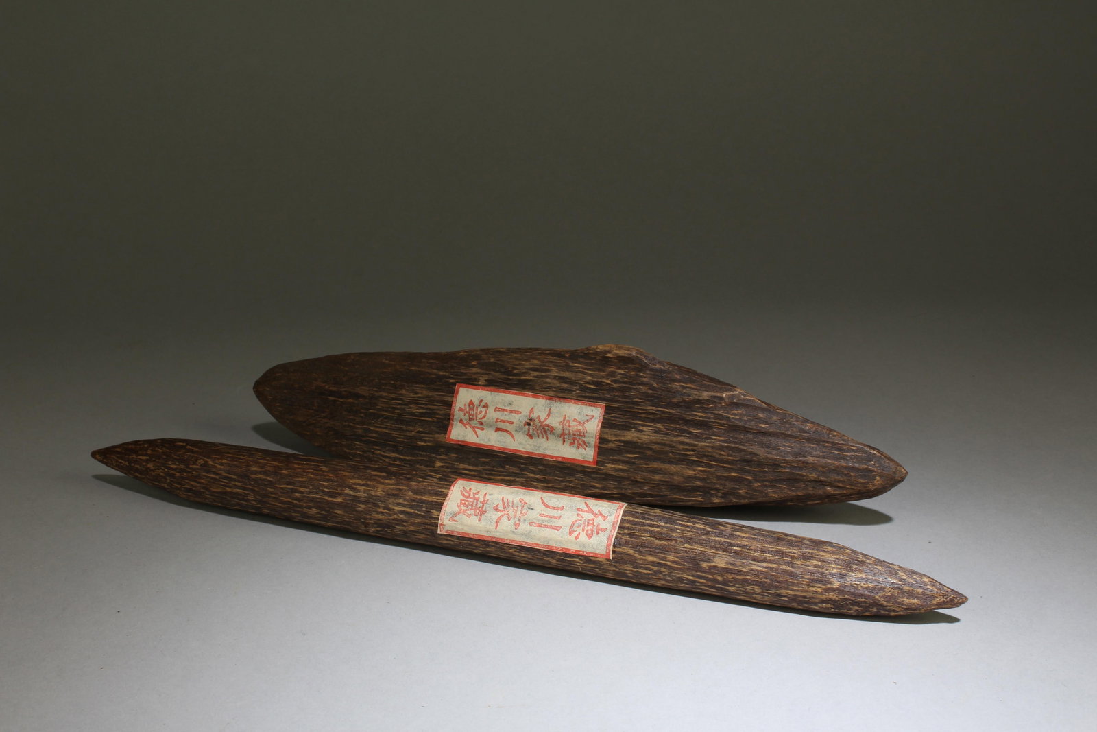 Agarwood Ornaments: Agarwood Ornaments. Longest Length: 13". Largest Width: 2.1". Formerly collected by the noble Tokugawa family in the Kansai region of Japan. These goods were first hidden in a temple called Bodaiji in