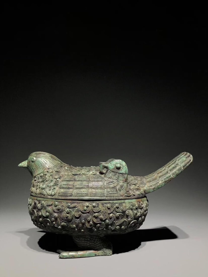 A Bronze Bird-Shaped Box: A Bronze Bird-Shaped Box. Dimensions: 14.17in x 7.48in x 7.48in Weight: 11.02lbs.