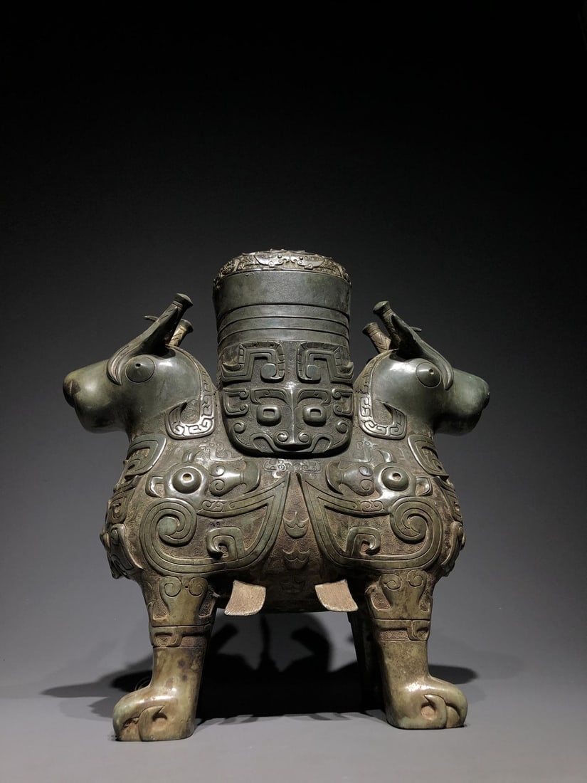 A Bronze Ritual Vessel: A Bronze Ritual Vessel. Dimensions: 14.57in x 4.92in x 8.27in Weight: 12lbs.