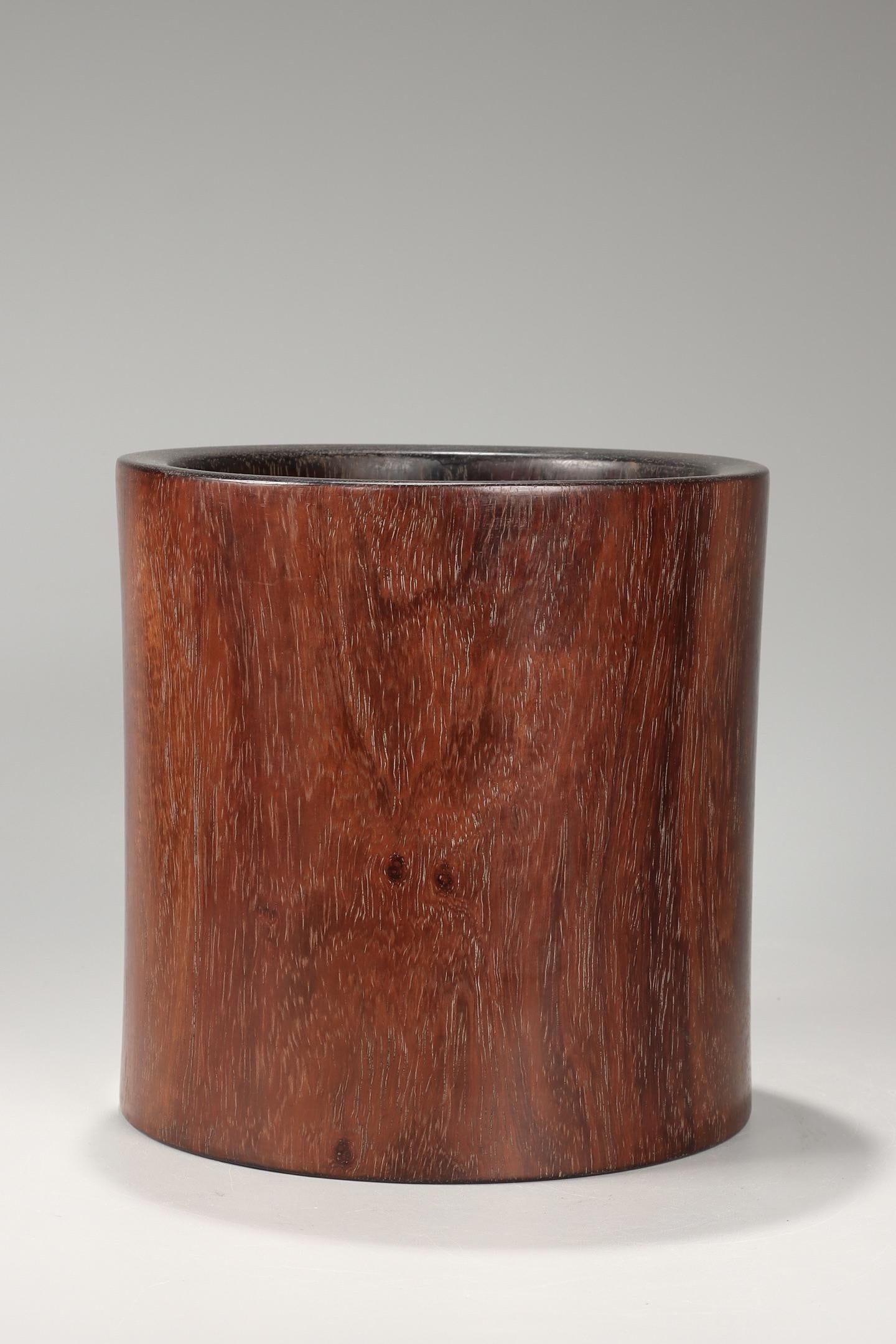 A Huanghuali Brushpot: A Huanghuali Brushpot. Height: 7.68in Diameter: 7.48in Weight: 3.12lbs.