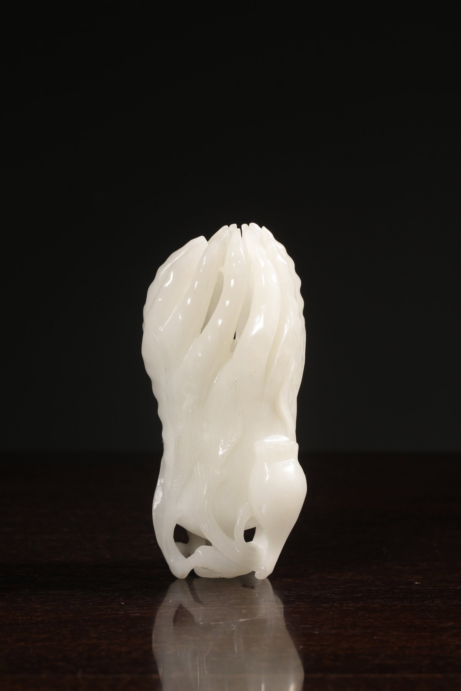 A Hetian Jade Buddha-Hand Ornament: A Hetian Jade Buddha-Hand Ornament. Dimensions: 4.13in x 2.17in Weight: 0.57lbs.