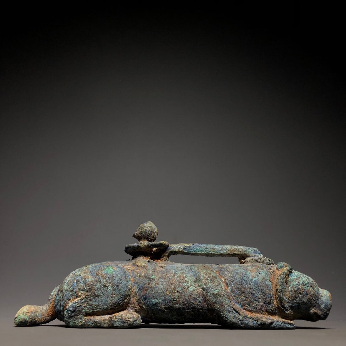 A Bronze and Jade Ornament: A Bronze and Jade Ornament. Dimensions: 7.87in x 1.97in x 2.76in Weight: 3.53lbs.