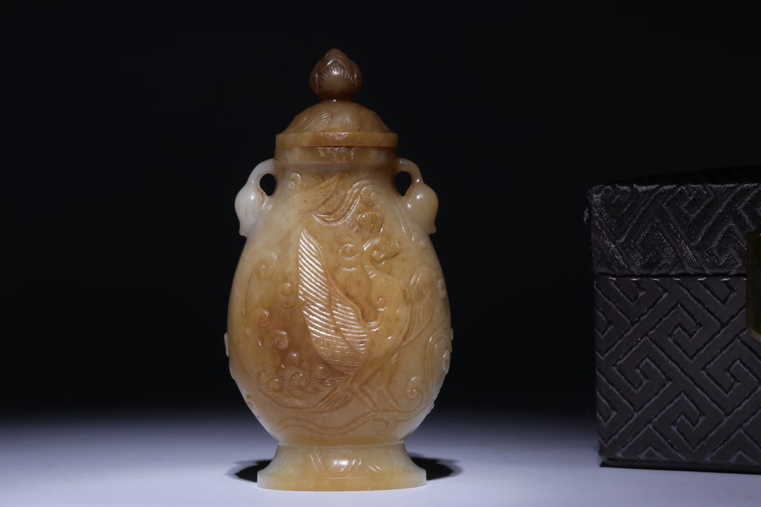 A Hetian Jade Vase: A Hetian Jade Vase. Height: 3.54in Width: 1.81in Weight: 0.19lbs.