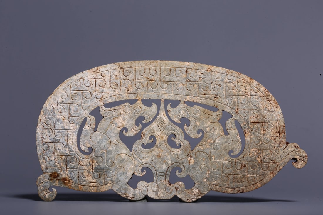 An Archaic Jade Double-Dragon Pendant: An Archaic Jade Double-Dragon Pendant. Dimensions: 0.12in x 4.53in x 2.28in Weight: 0.10lbs.