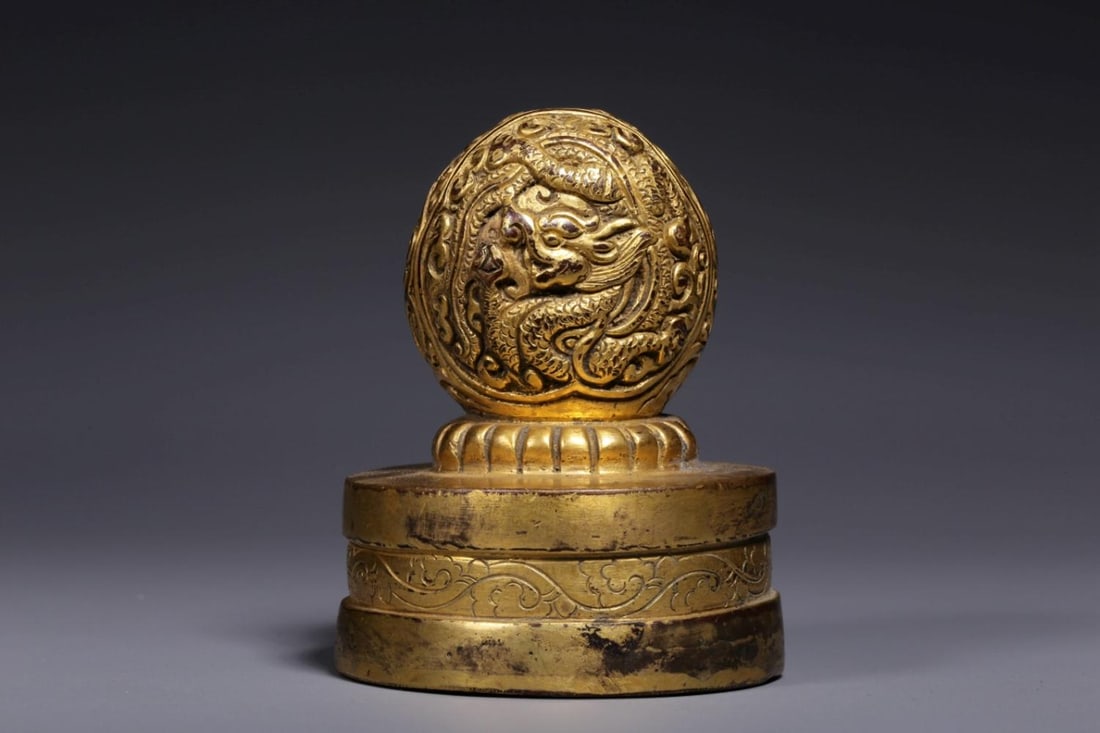 A Gilt Bronze Seal: A Gilt Bronze Seal. Height: 3.15in Diameter: 2.48in Weight: 1.05lbs.