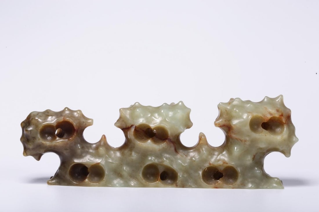 A Hetian Jade Brushrest: A Hetian Jade Brushrest. Dimensions: 1.65in x 5.12in x 0.83in Weight: 0.31lbs.