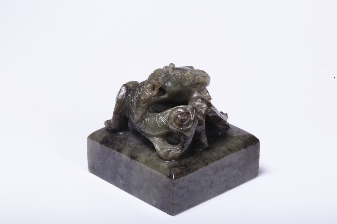 A Hetian Jade Seal: A Hetian Jade Seal. Dimensions: 1.97in x 1.97in x 1.97in Weight: 0.38lbs.