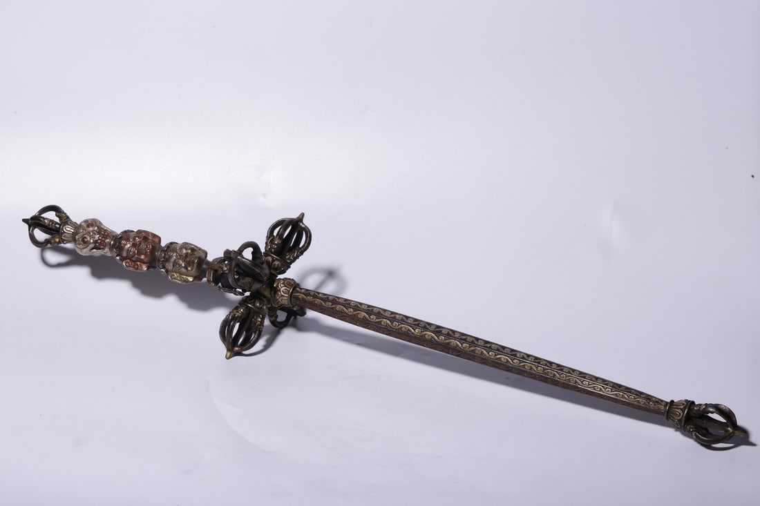An Iron Ritual Staff: An Iron Ritual Staff. Height: 25.87in Width: 5.51in Weight: 8.60lbs.