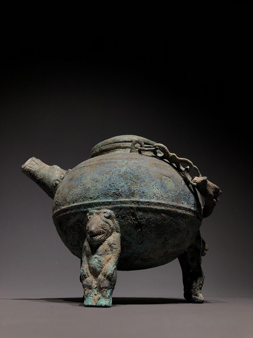 A Bronze Ewer: A Bronze Ewer. Dimensions: 6.69in x 5.51in x 6.69in Weight: 5.95lbs.