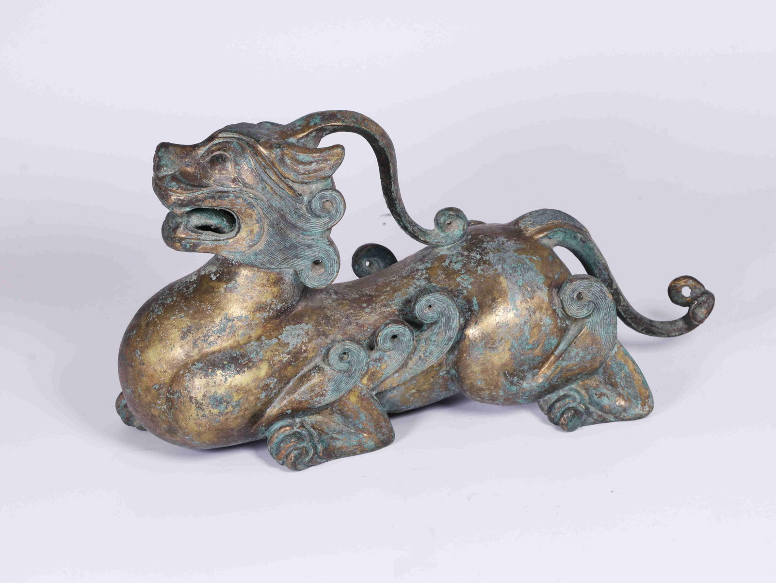 A Gilt Bronze Mythical Beast: A Gilt Bronze Mythical Beast. Dimensions: 11.81in x 4.33in x 6.69in.