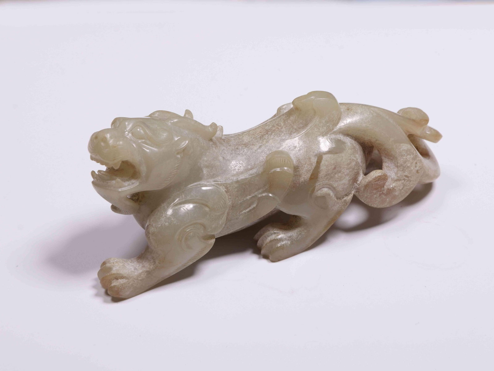 A Jade Pixiu: A Jade Pixiu. Dimensions: 3.94in x 1.38in x 1.81in.