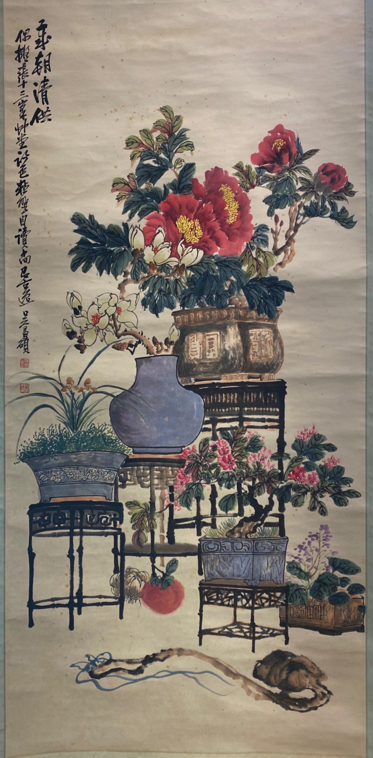 Chinese Hanging Scroll Painting: Ink and color on paper, depicting flowers in pots, signed with seal attributed to Wu Chang Shuo. Height: 51.5" Length: 25.75"