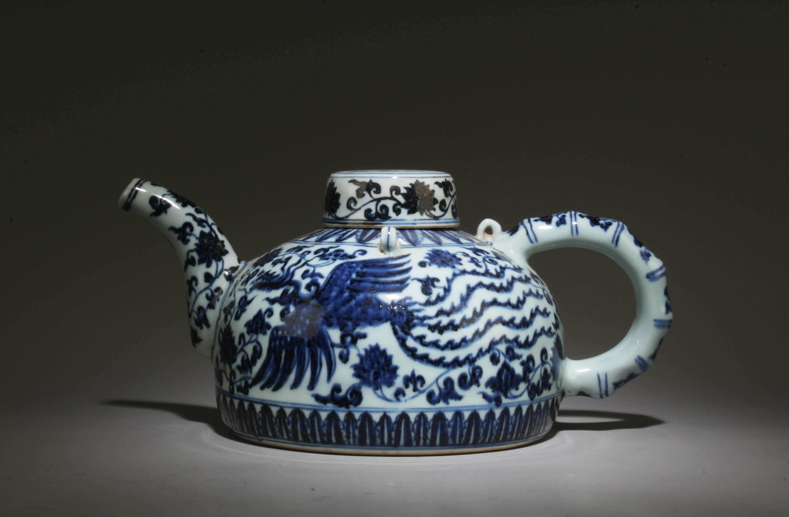 A Blue and White Phoenix Pot with Lid: A Blue and White Phoenix Pot with Lid. Dimensions: 5.5" x 11.5".