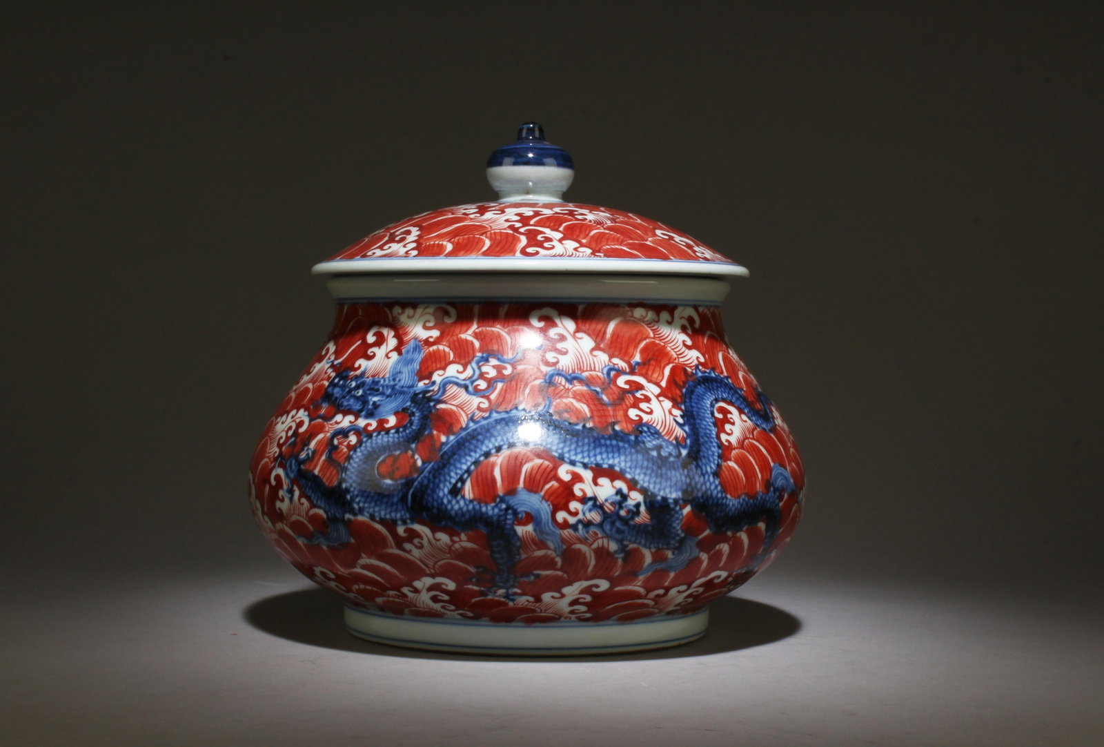 A Blue and Red Jar with Lid: A Blue and Red Jar with Lid. Dimensions: 8.5" x 8.75".