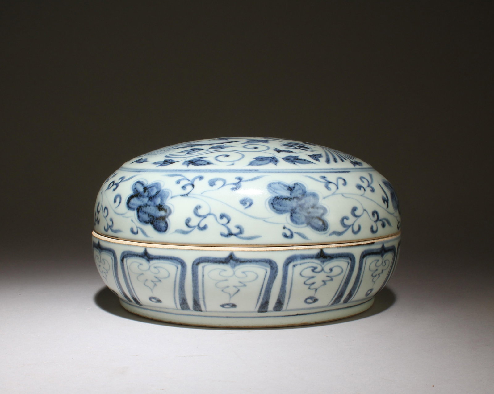 A Blue and White Porcelain Lidded Box: A Blue and White Porcelain Lidded Box. Dimensions: 8.5'' x 4.25''