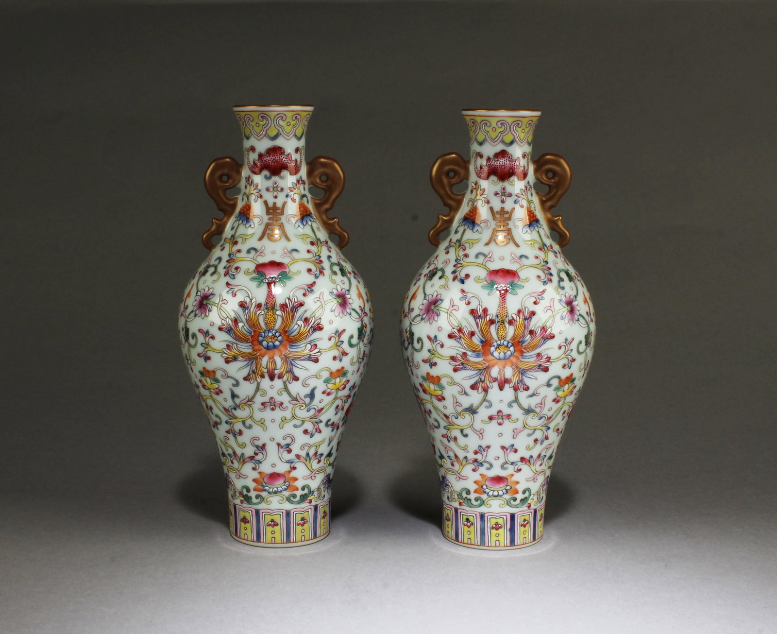 A Pair of FaLangCai Vases: A Pair of FaLangCai Vases, flanked by twin handles. 'YongZheng' mark. Height: 7.25"