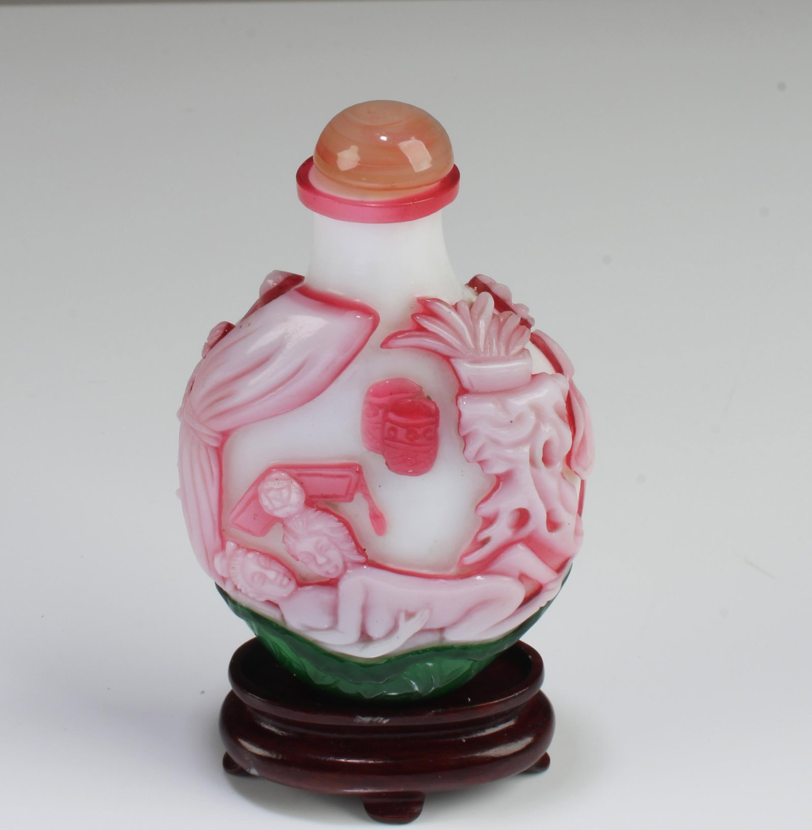 Chinese Porcelain Snuff Bottle: Chinese Porcelain Snuff Bottle. 'QianLong' mark at base. Comes fitted with a stand. Height: 3.15" ( does not include stand)