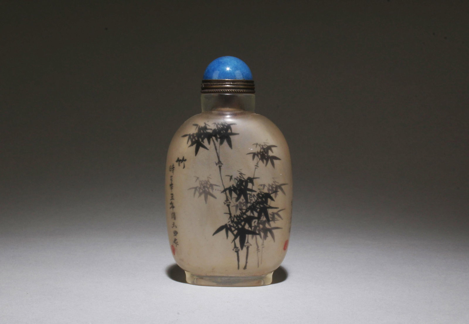 A Chinese Crystal Glass Snuff Bottle: A Chinese Crystal Glass Snuff Bottle. Dimensions: 3.5" x 2".