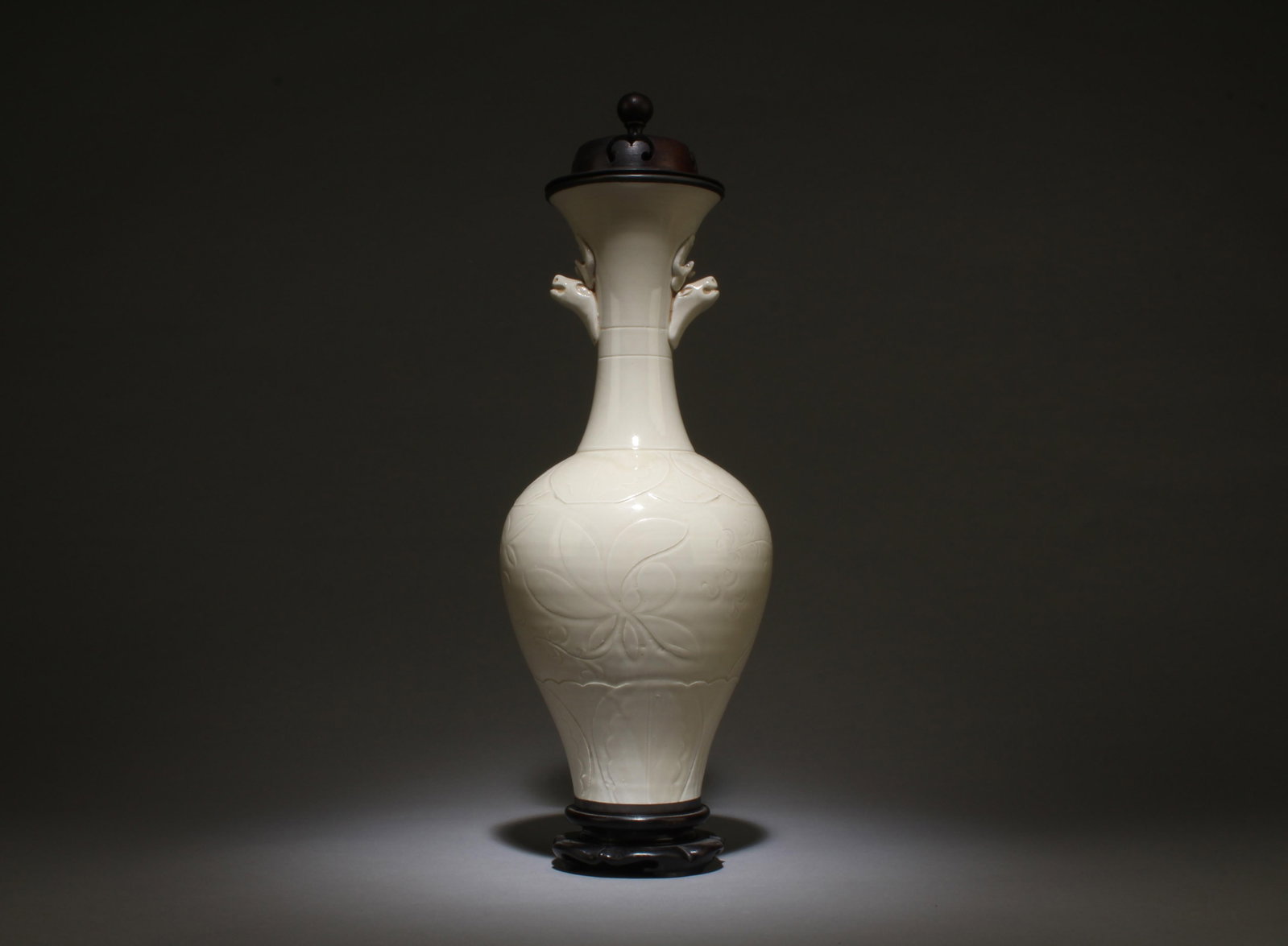A Dingyao Vase with Stand: A Dingyao Vase with Stand. Dimensions: 12.2" x 5.5". Dimensions with stand: 16.5" x 5.5".