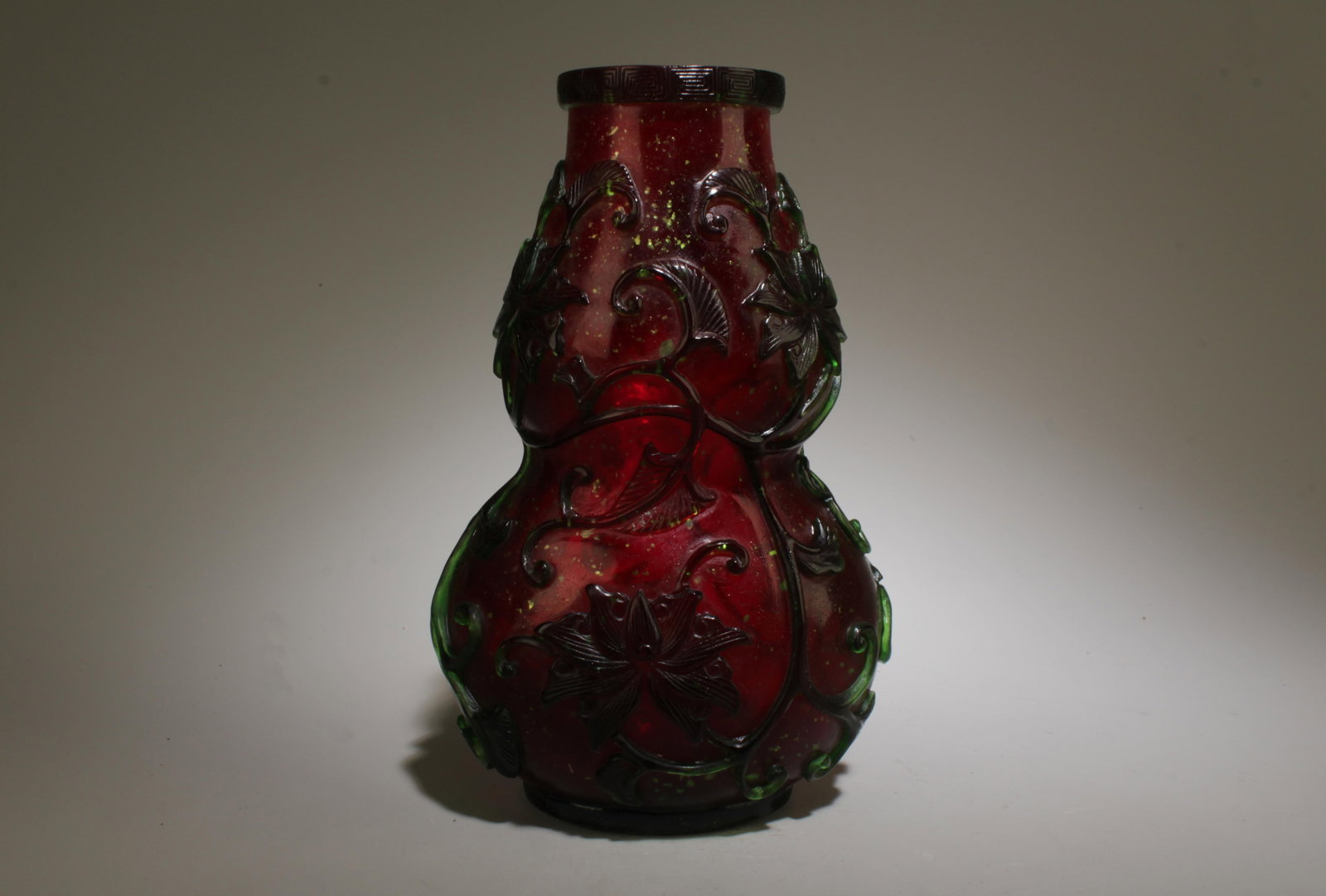 A Pekking Glass Vase: A Pekking Glass Vase. Dimension: 4" x 6.25".