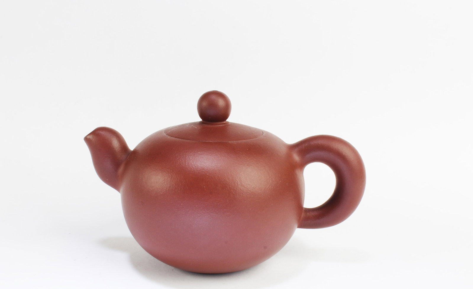 Chinese Zisha Teapot: Chinese Zisha Teapot. Length: 6.25"
