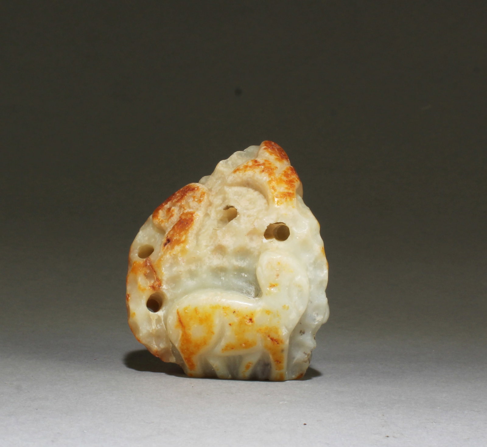 A Carved Hetian Jade Ornament: A Carved Hetian Jade Incense Burner Lid knob. Height: 2.5"