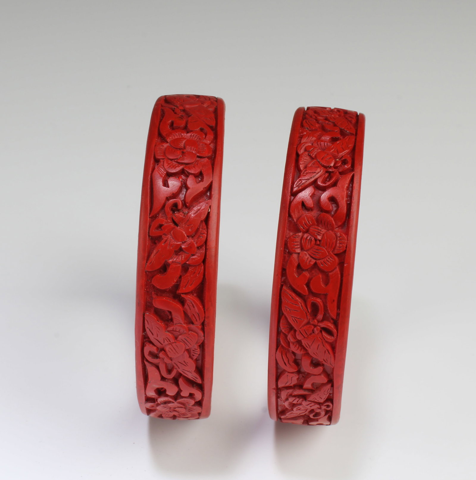 A Pair of Cinnabar Lacquer Bracelets: A Pair of Cinnabar Lacquer Bracelets. Diameter: 2.75"