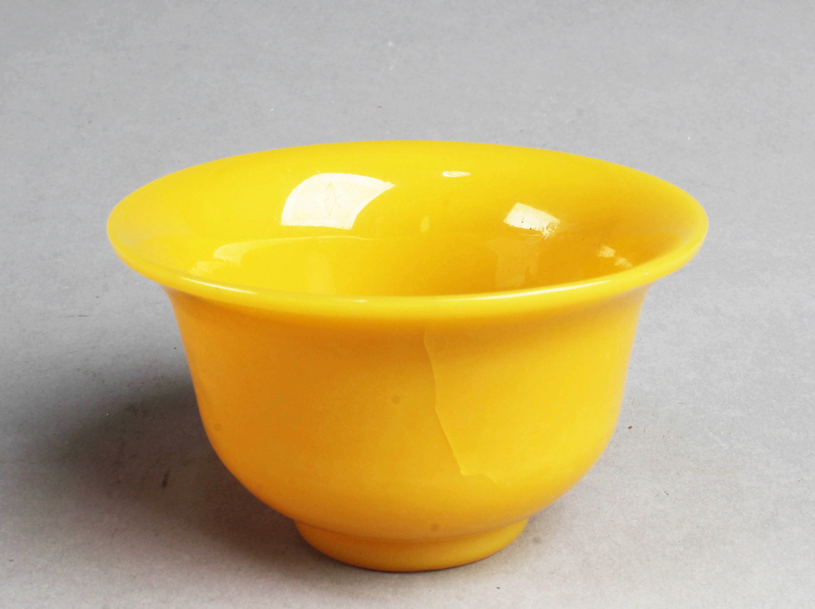 A Yellow Color Peking Glass Cup: A Yellow Color Peking Glass Cup. Diameter: 3.35"