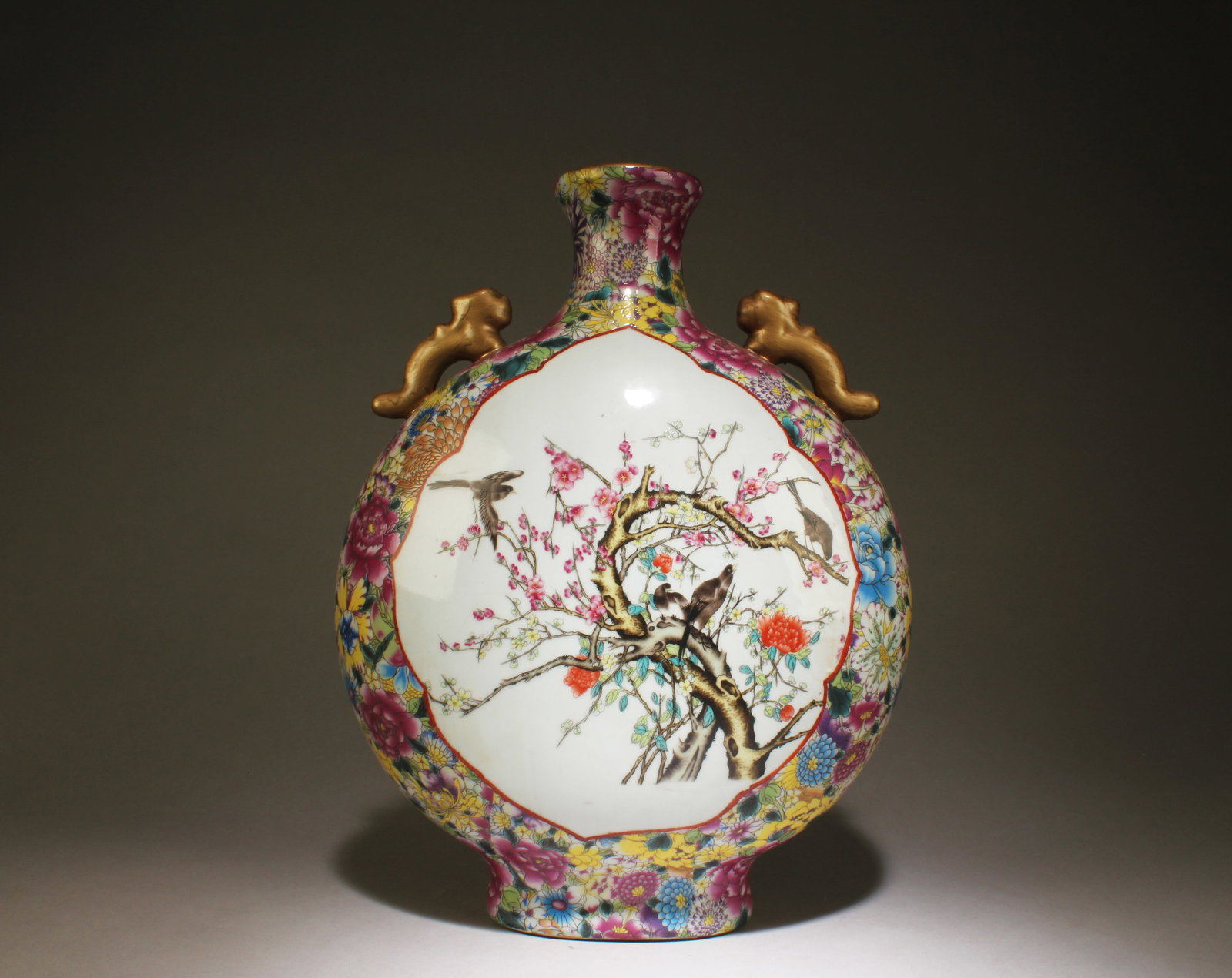 A Famille Rose Moon Vase: A Famille Rose Moon Vase. Dimensions: 14" x 10.5" x 5.75".