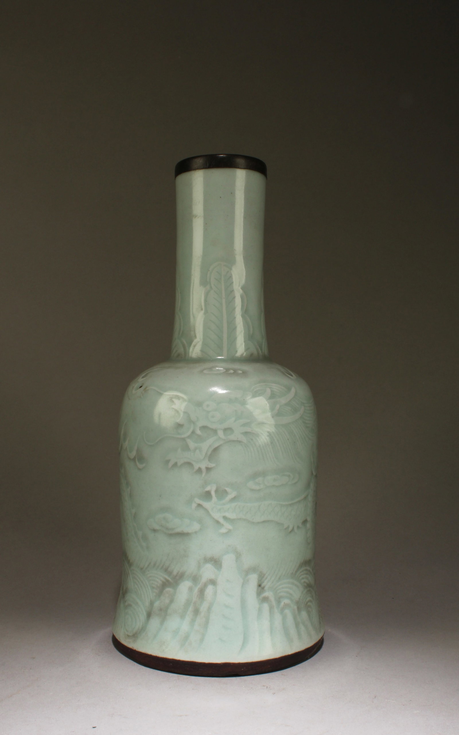 A Dragon Design Celedon Vase: A Dragon Design Celedon Vase. Dimensions: 11" x 5".
