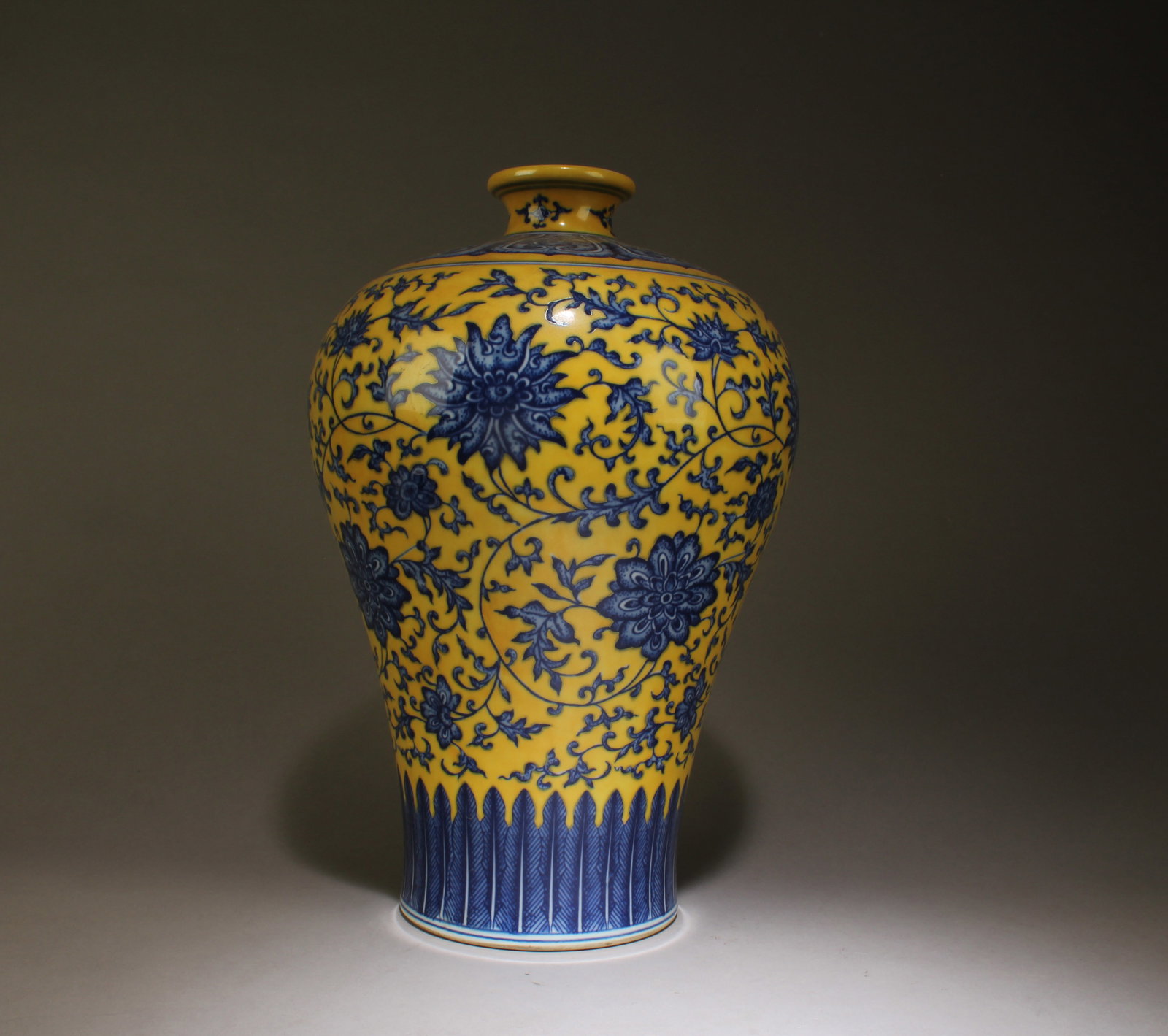A Blue and Yellow Porcelain Vase: A Blue and Yellow Porcelain Vase. Dimensions: 13" x 8.75".