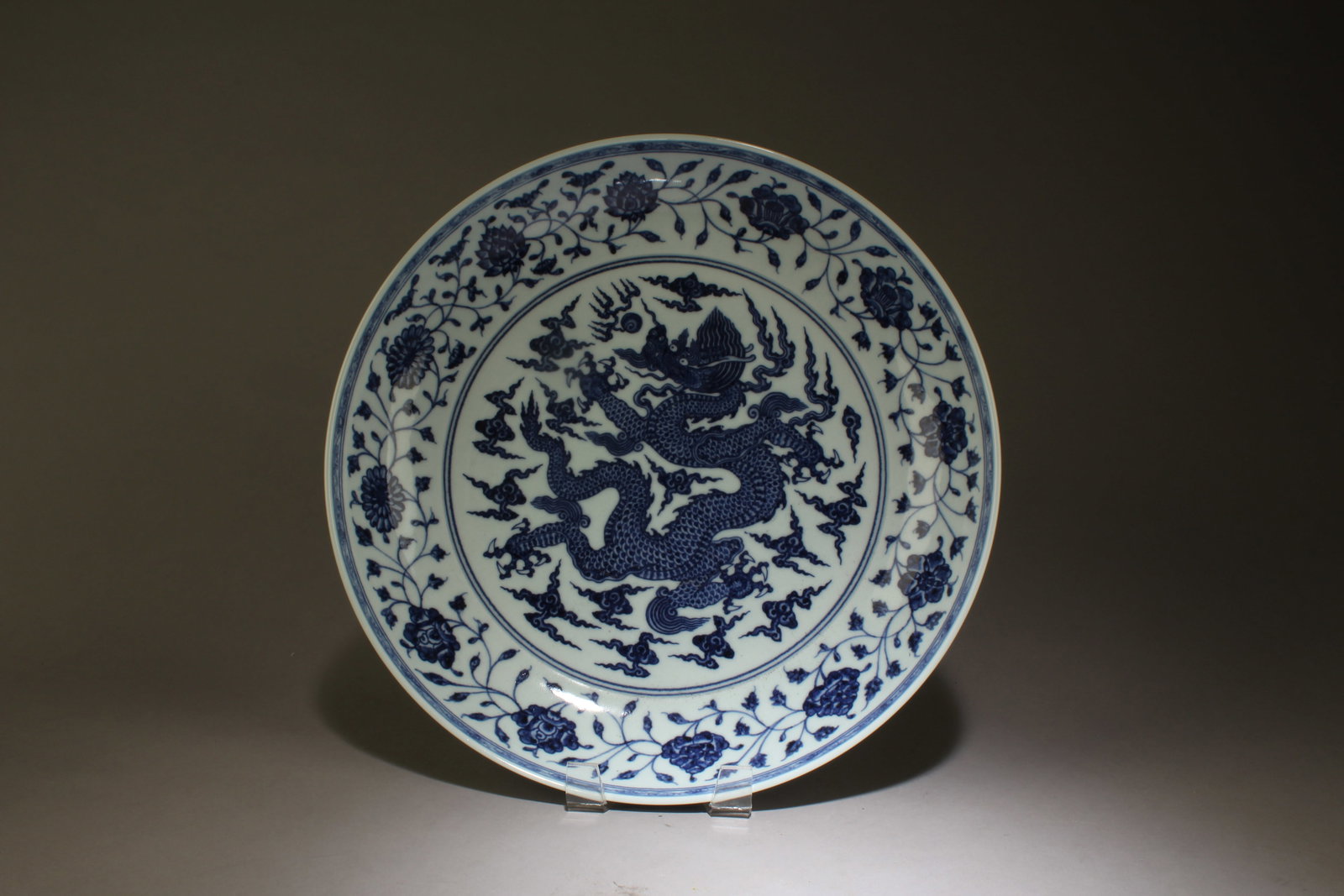 A Chinese Blue and White Plate: A Chinese Blue and White Plate. Dimensions: 2.5" x 13.25".