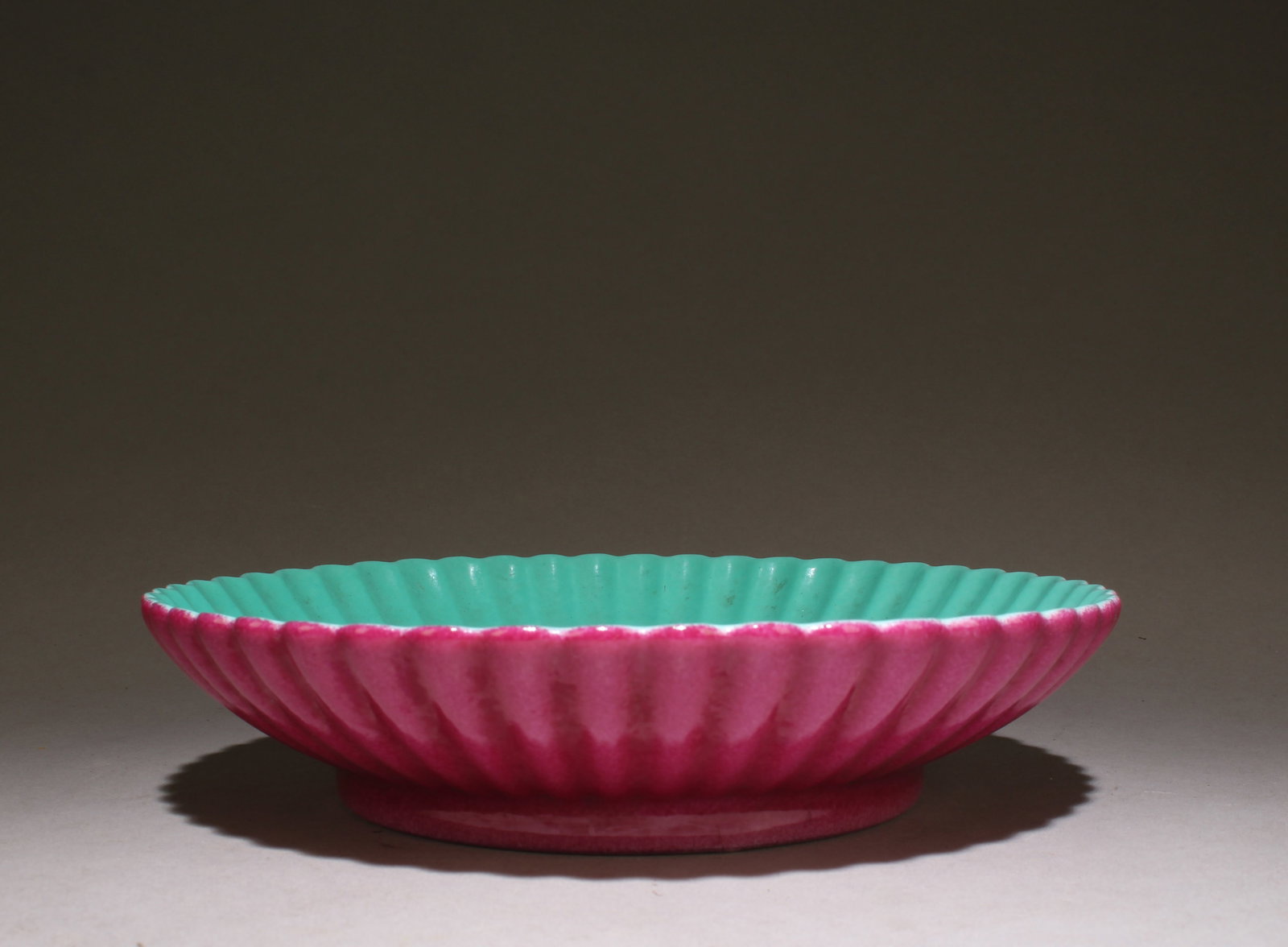 A Turquoise Glaze Plate: A Turquoise Glaze Plate. Dimensions: 7" x 1.5".