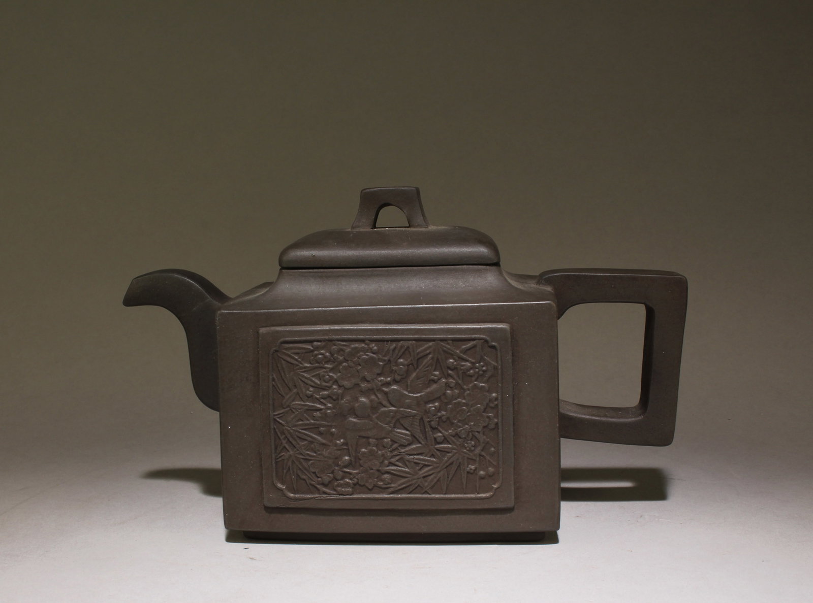 A Chinese Zisha Teapot: A Chinese Zisha Teapot. Dimensions: 8" x 4.6 ".