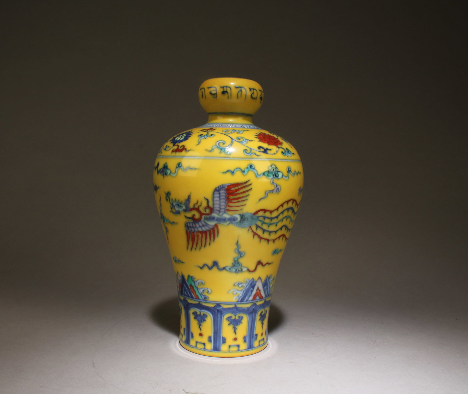 A Chinese Yellow Underglaze Fencai Vase: A Chinese Yellow Underglaze Fencai Vase. Dimensions: 8.5" x 4.5".