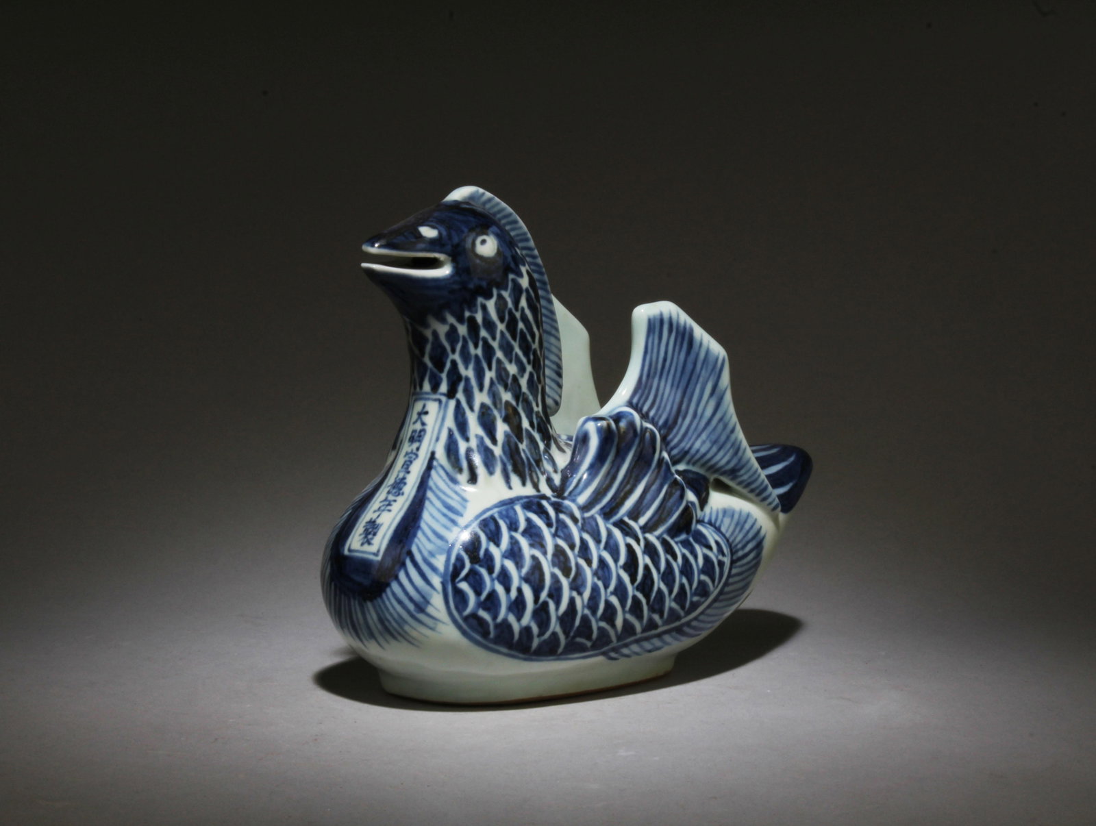 A Blue and White Duck Ornament: A Blue and White Duck Ornament. Dimensions: 7.75" x 6.5".