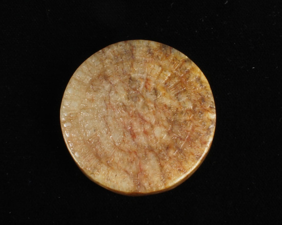 A Round Jade Ornament: A Round Jade Ornament. Diameter: 1.75"