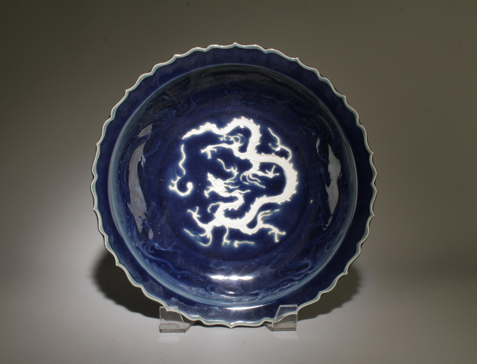 A Porcelain Dragon Plate: A Porcelain Dragon Plate. Dimension: 12" x 2".