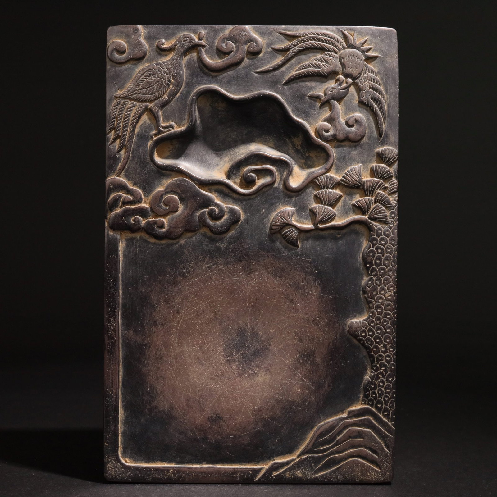 A Duan Inkstone: A Duan Inkstone. Dimensions: 8.46" x 5.43" x 1.18". Weight: 5.31lbs.