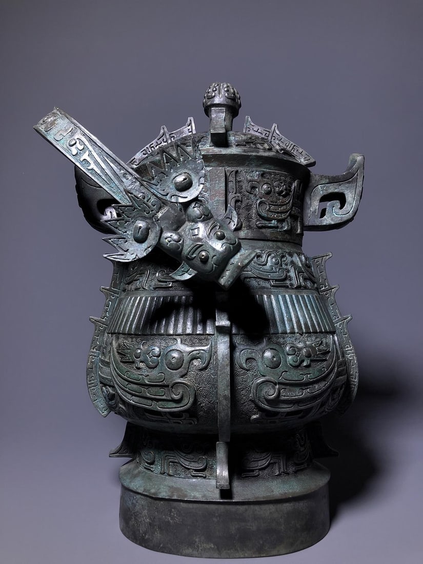 A Bronze Pouring Vessel: A Bronze Pouring Vessel. Dimensions: 11.81" x 11.02" x 17.32". Weight: 57.32lbs.