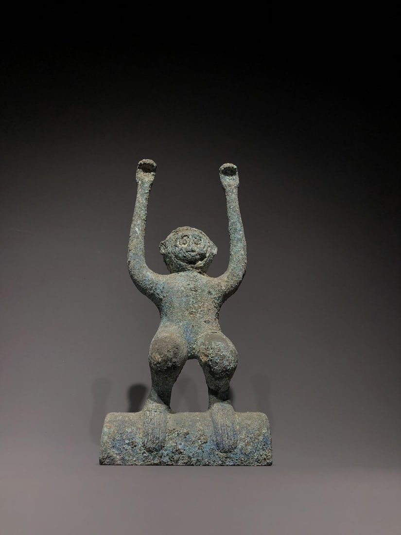 A Long?Armed Monkey Figure: A Long?Armed Monkey Figure. Dimensions: 5.51" x 1.97" x 12.20". Weight: 7.05lbs.