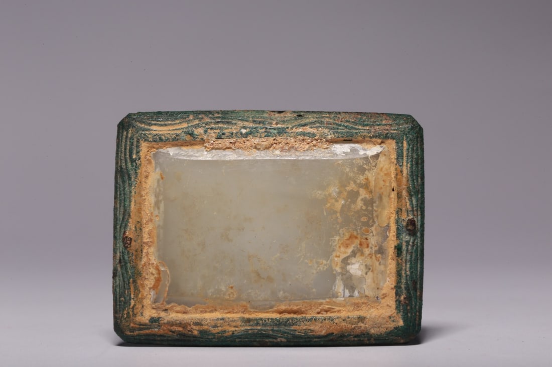 A Hetian Jade and Bronze Belt Buckle: A Hetian Jade and Bronze Belt Buckle. Dimensions: 2.24" x 1.69" x 0.55". Weight: 0.11lbs.