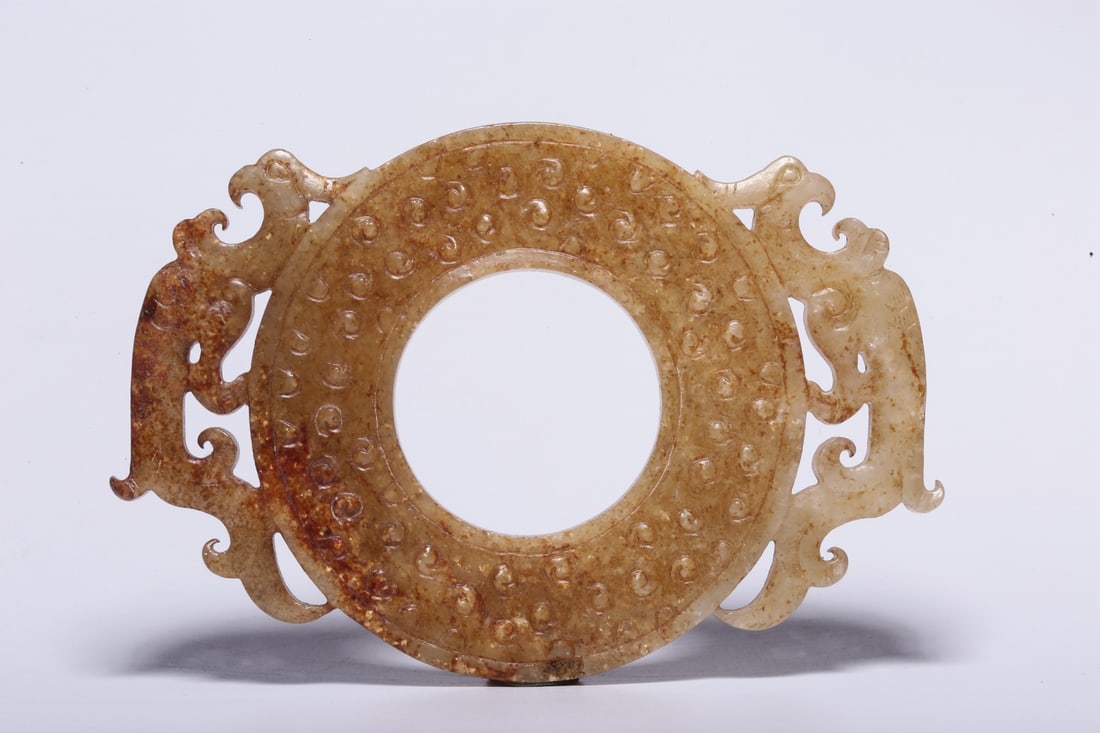 A Hetian Jade Bi Disc: A Hetian Jade Bi Disc. Dimensions: 4.13" x 2.95" x 0.24". Weight: 0.14lbs.