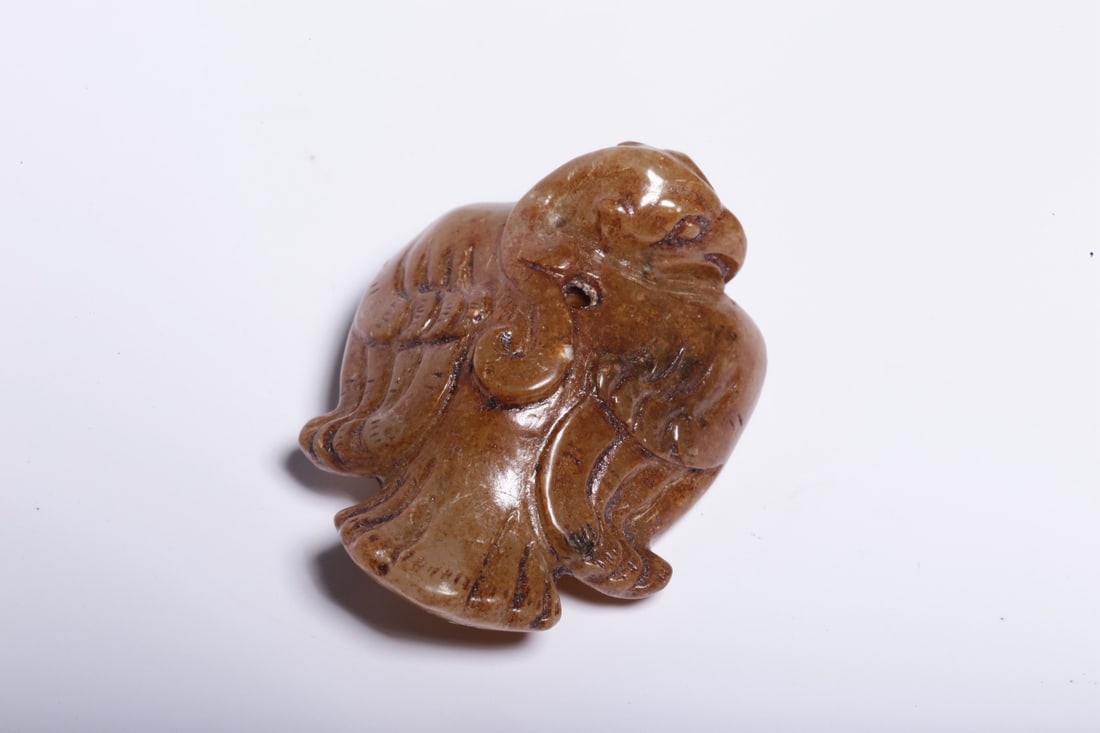A Hetian Jade Bird Ornament: A Hetian Jade Bird Ornament. Dimensions: 1.57" x 1.26" x 0.67". Weight: 0.05lbs.