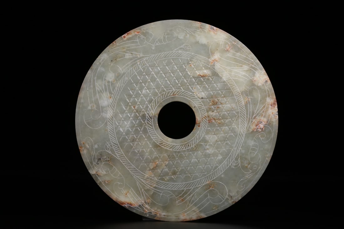 A Hetian Jade Bi Disc: A Hetian Jade Bi Disc. Diameter: 7.09"; Thickness: 0.24". Weight: 0.85lbs.
