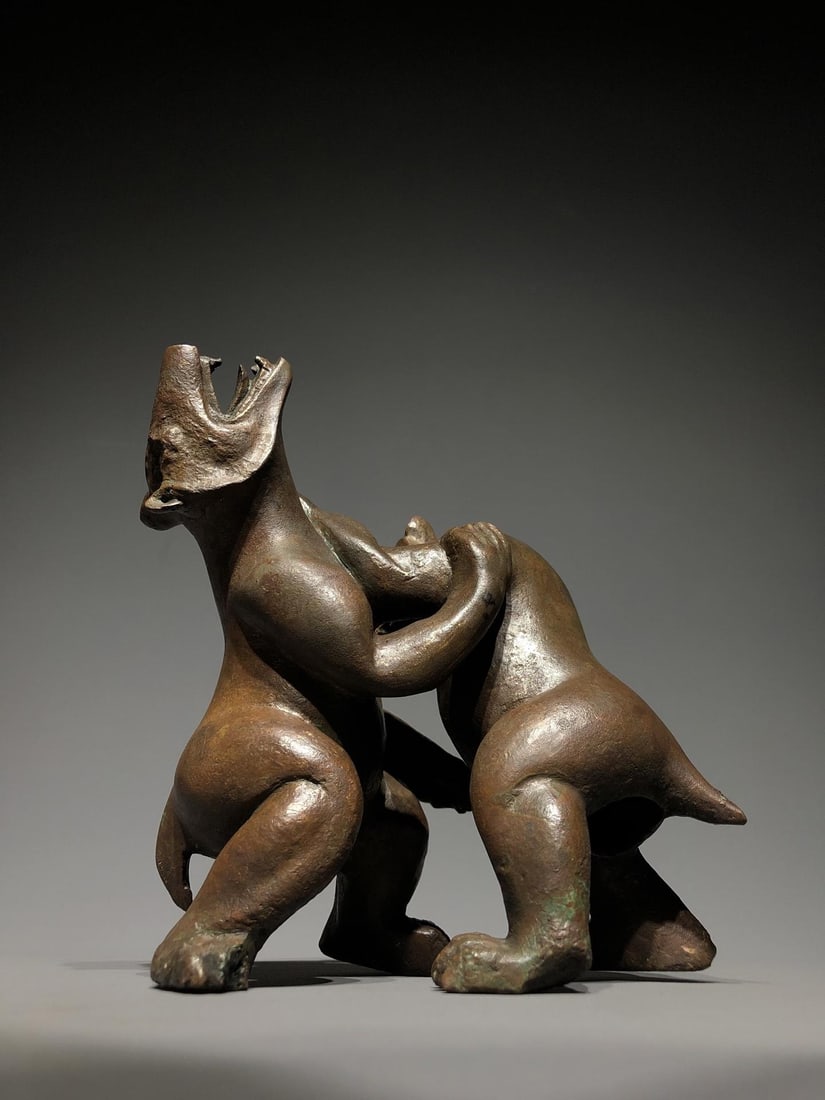 A Bronze Double?Bear Figure: A Bronze Double?Bear Figure. Dimensions: 5.51" x 3.94" x 5.91". Weight: 5.73lbs.