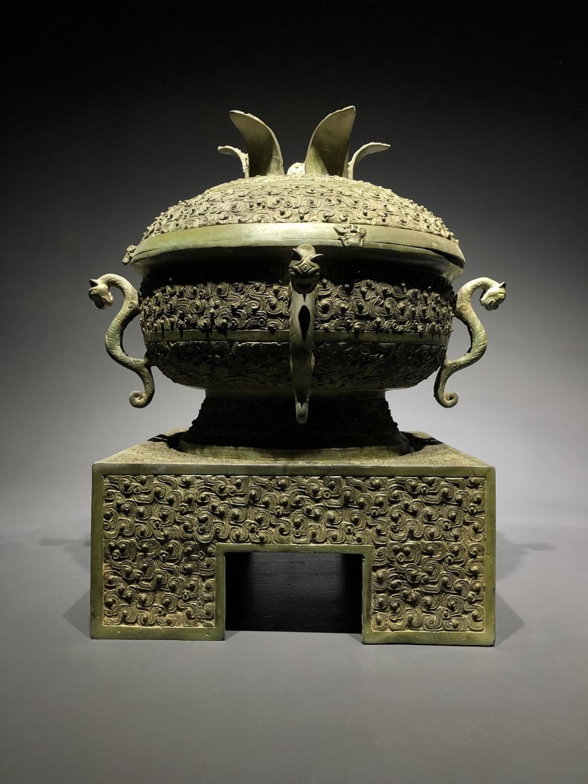 A Bronze Gui Vessel: A Bronze Gui Vessel. Diameter: 12.20"; Width: 12.20"; Height: 12.20". Weight: 26.46lbs.