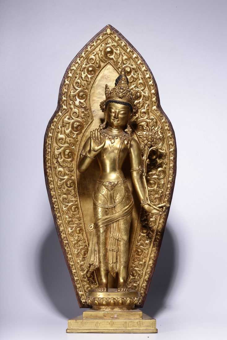 A Gilt Bronze Guanyin Statue: A Gilt Bronze Guanyin Statue. Height: 20.47"; Length: 9.06"; Width: 3.54". Weight: 8.19lbs.