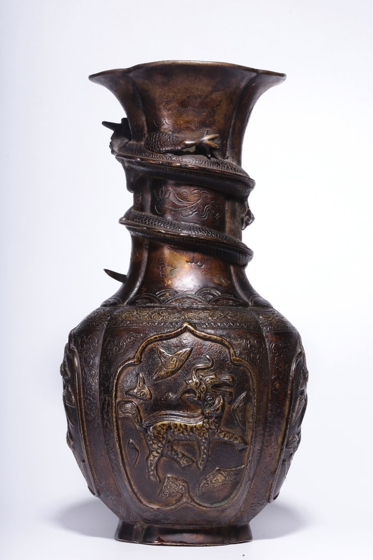 A Bronze Vase: A Bronze Vase. Height: 14.57"; Length: 7.48"; Width: 6.30". Weight: 26.62lbs.