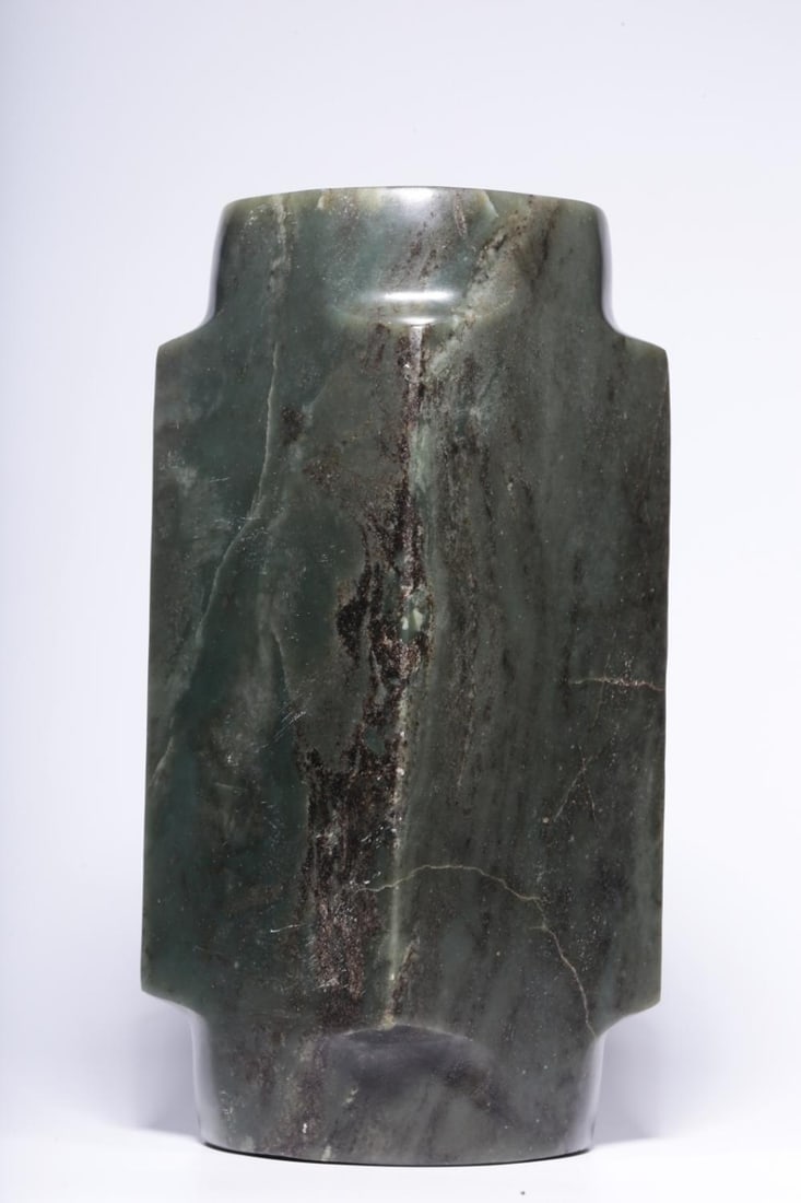 An Archaic Jade Cong: An Archaic Jade Cong. Length: 3.27"; Width: 3.27"; Height: 8.03". Weight: 4.38lbs.